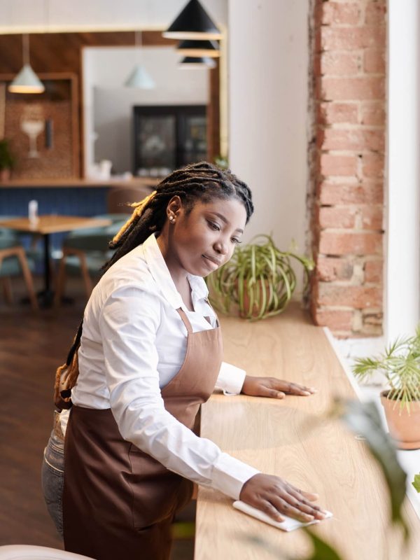 young-black-waitress-cleaning-table.jpg